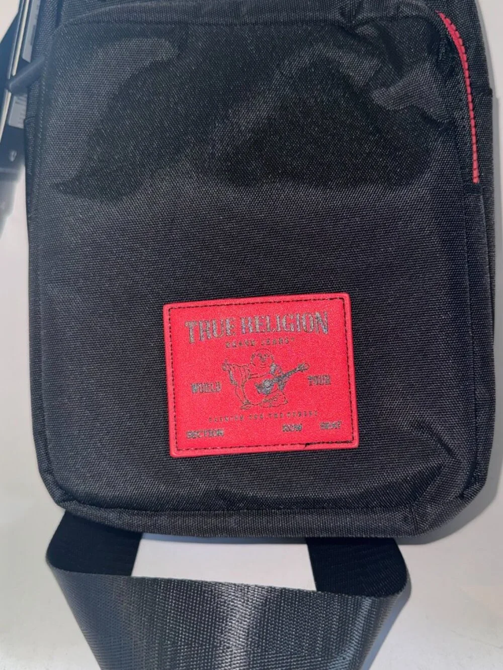True Religion Sling Bag Features a Textured Brand Patch Durable Nylon With Red